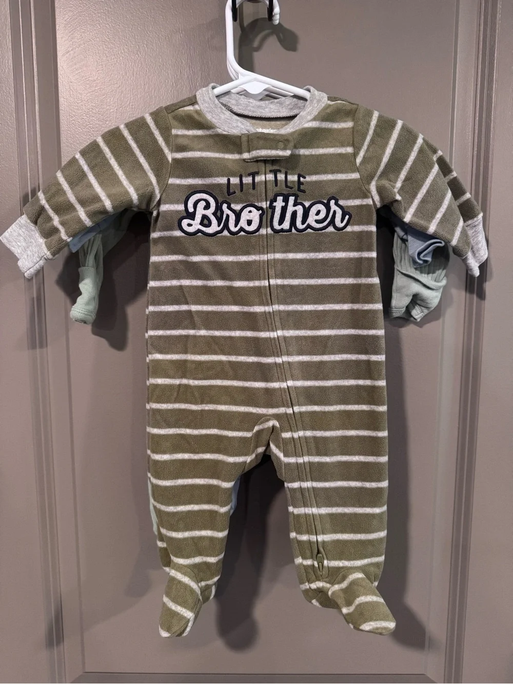 Three piece lot of infant boys footed pajamas. “Little Brother” themed.